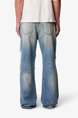 COWBOY DISTRESSED KICK FLARE DENIM